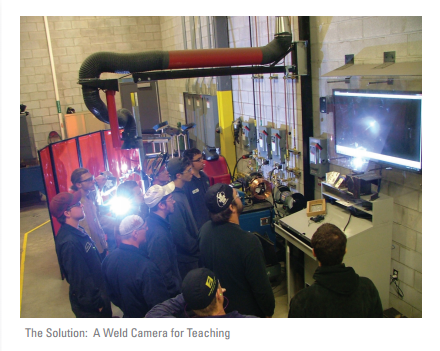 Students viewing a weld demonstration from a display monitor