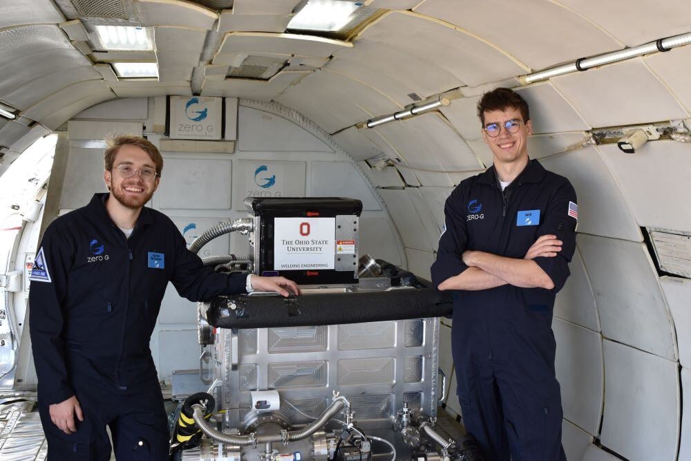 Aaron Brimmer and Will McAuley, graduate students from Ohio State University inside the airplane