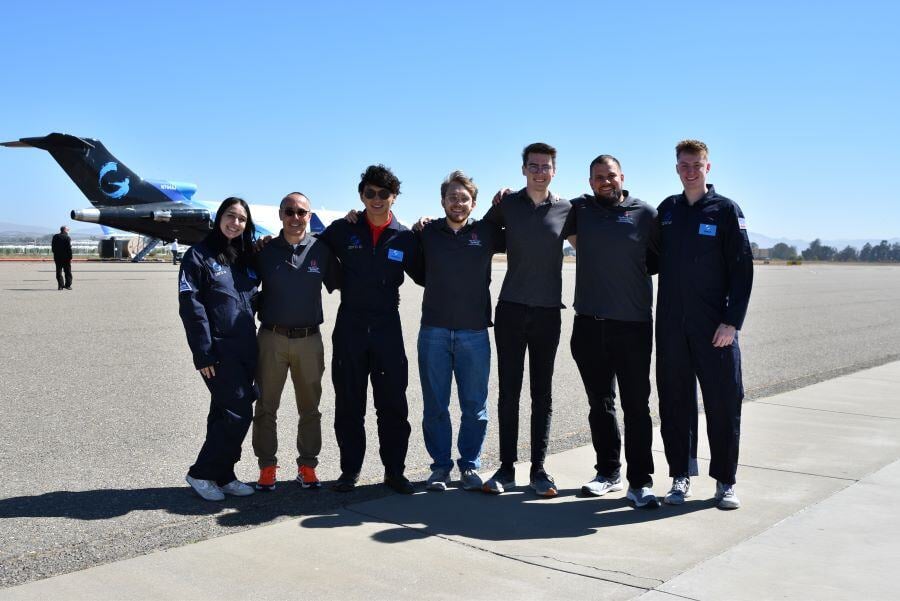 The LUNAR Weld team of OSU posing with the Zero-G airplane behind.